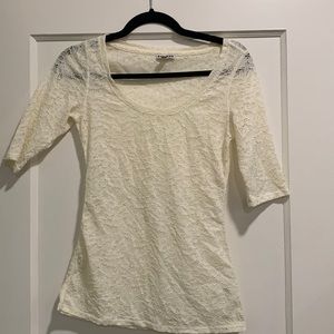 Express top size small. Cream color with flower print throughout.